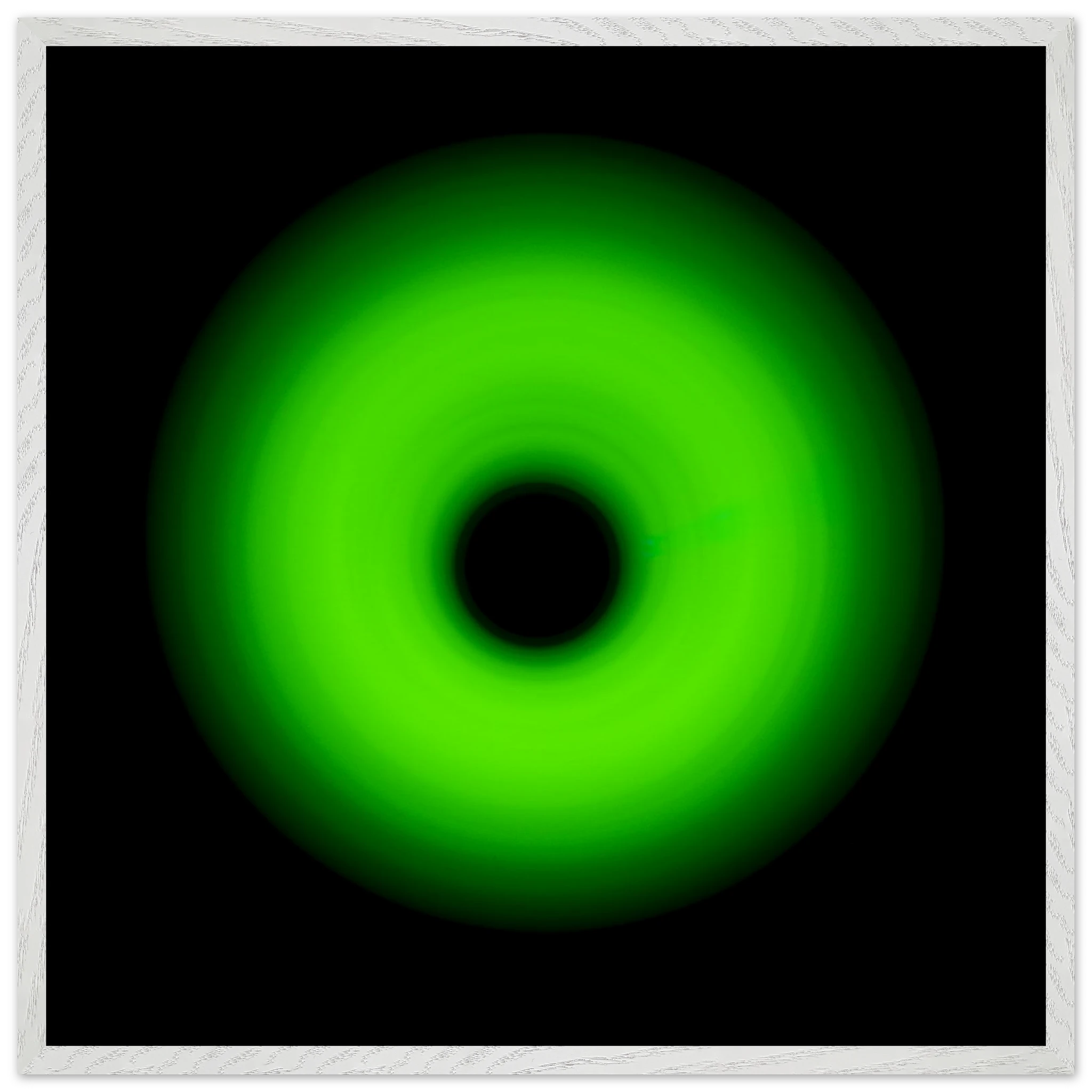 A circular ring of bright lime green light with concentric circles and a glowing center core against a black background.