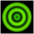 A circular disc with concentric color rings radiating from a small black center dot, transitioning from yellow core through orange, purple, and blue to bright lime green outer edge.