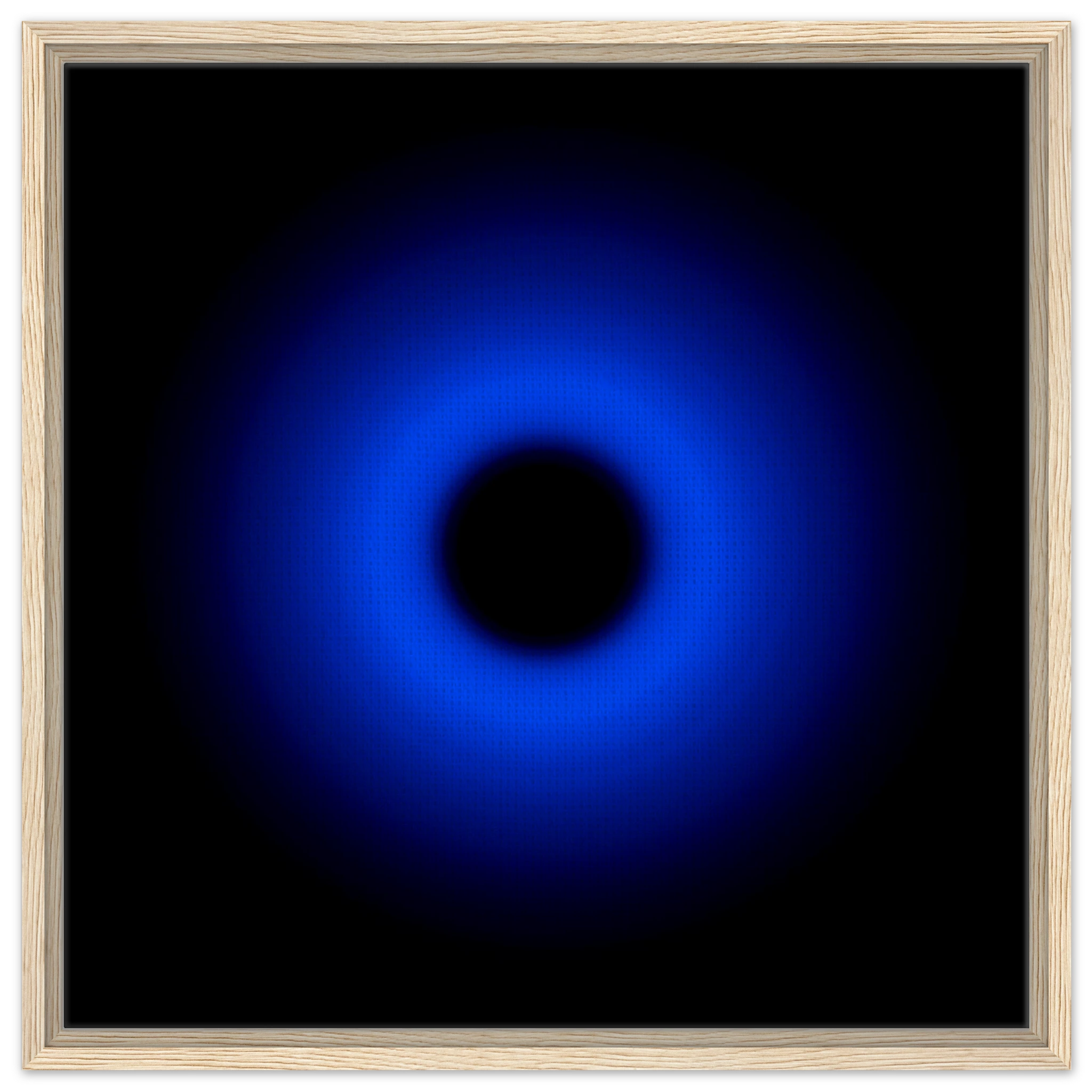 A circular ring of deep blue light surrounds a black center, gradually fading outward into darkness.