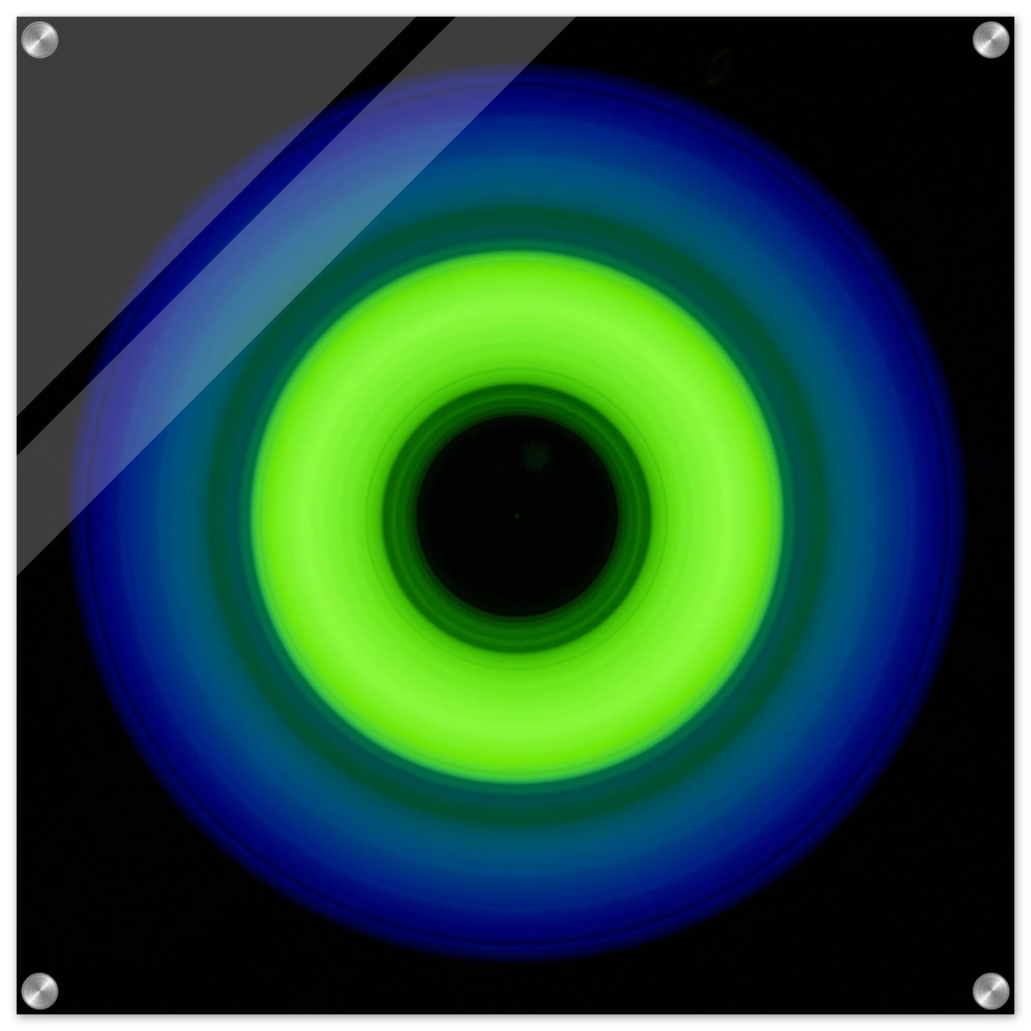 A circular ring shape with bright lime green center transitioning through teal to cobalt blue outer edge with black center void.