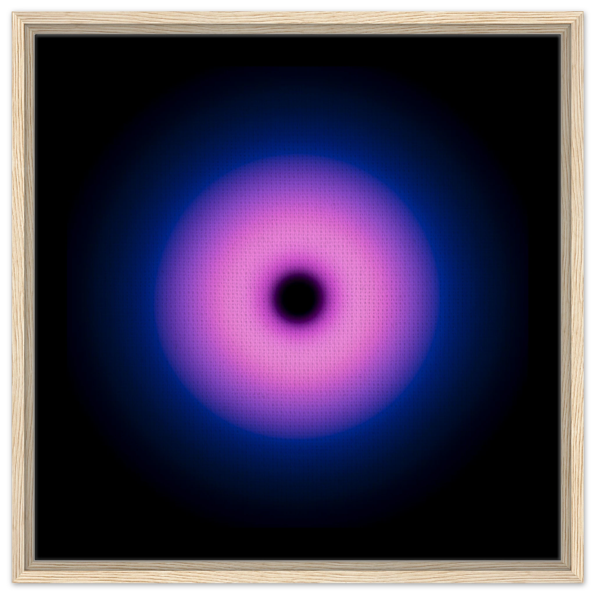 A circular gradient shape with a black center that transitions from hot pink to purple to deep blue at the outer edges.