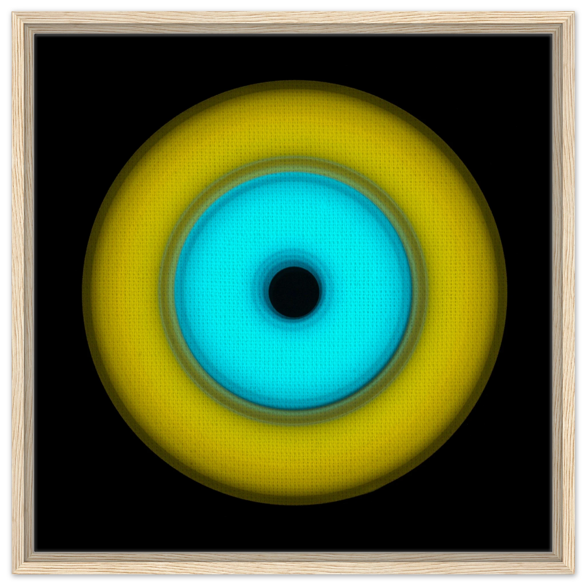 A circular aperture shape with bright yellow outer ring, electric cyan inner circle, and small black center hole against a black background.